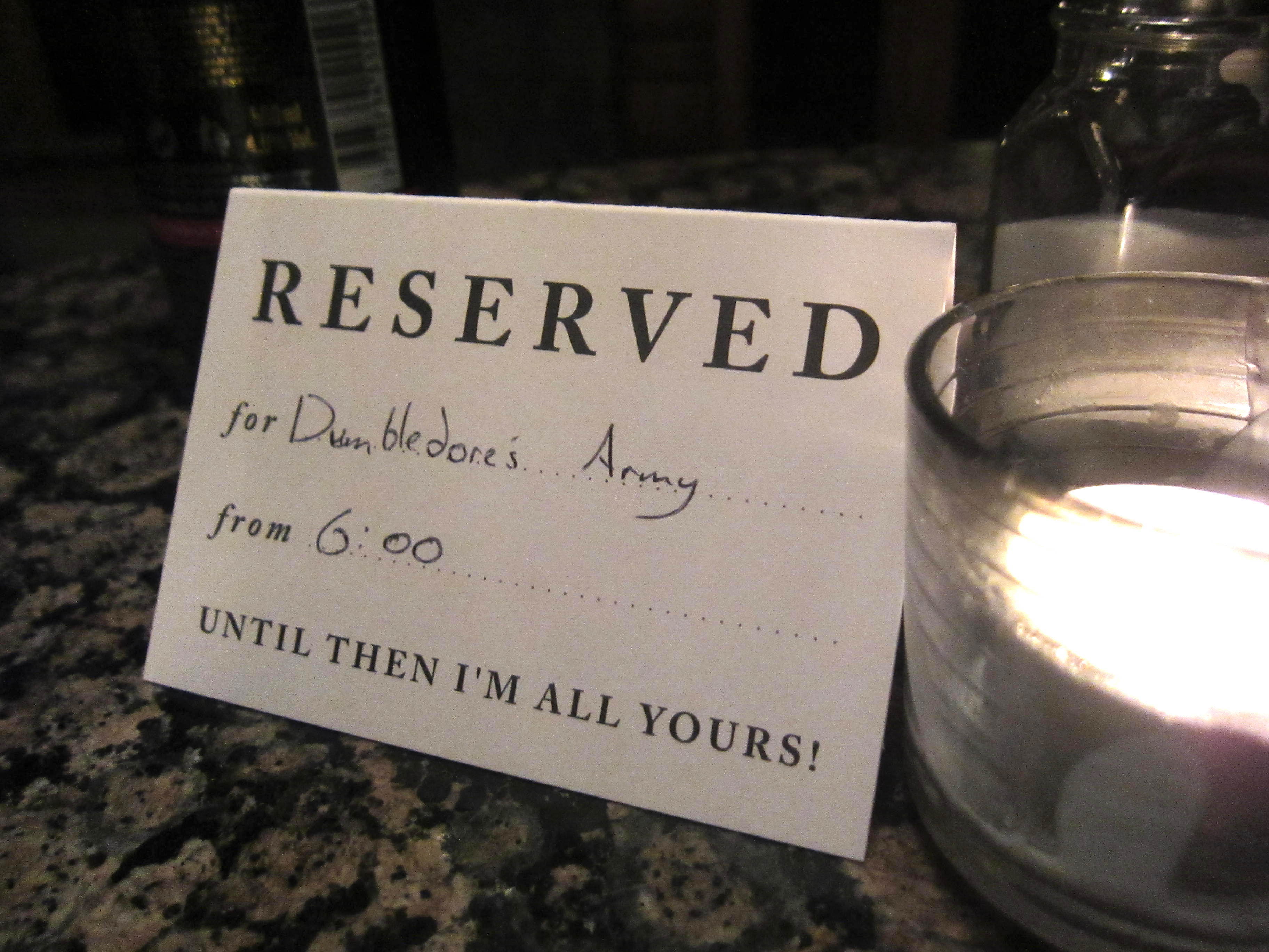 standard "reserved for" card set out on a pub table, but this one is filled out as "reserved for Dumbledore's Army"